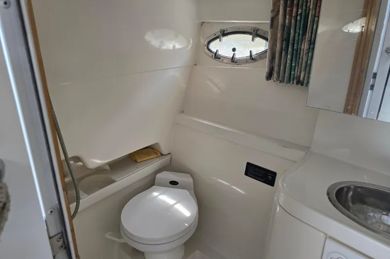 Slide: The Image of Bathroom interior of a 1997 Formula 34 Performance Cruiser boat. - 31