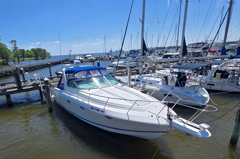 Slide: The Image of 1997 Formula 34 Performance Cruiser docked at a marina on a sunny day. - 8