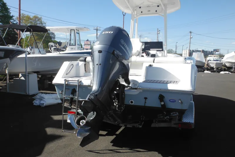Slide: The Image of 2024 Tidewater 210 LXF boat with Yamaha outboard motor, displayed at a dealership. - 3