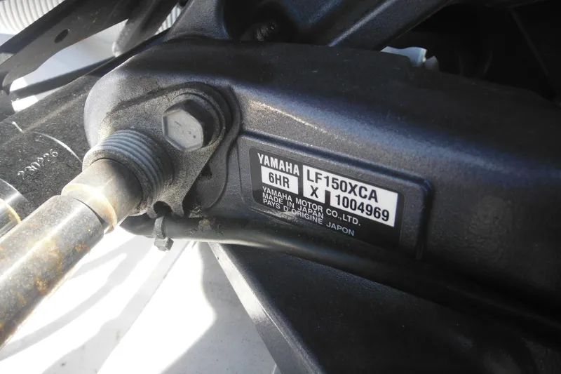Slide: The Image of Close-up of Yamaha LF150XCA engine part on 2024 Tidewater 210 LXF boat. - 5