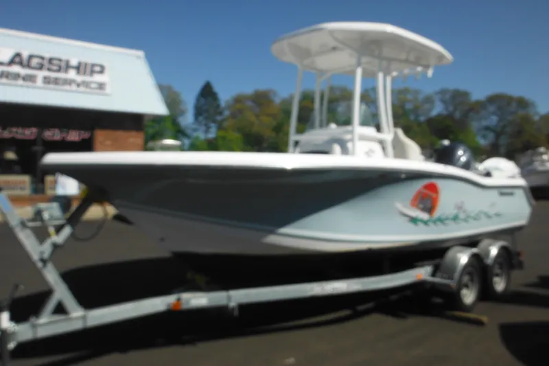 Slide: The Image of 2024 Tidewater 210 LXF boat on trailer at marine service center. - 6