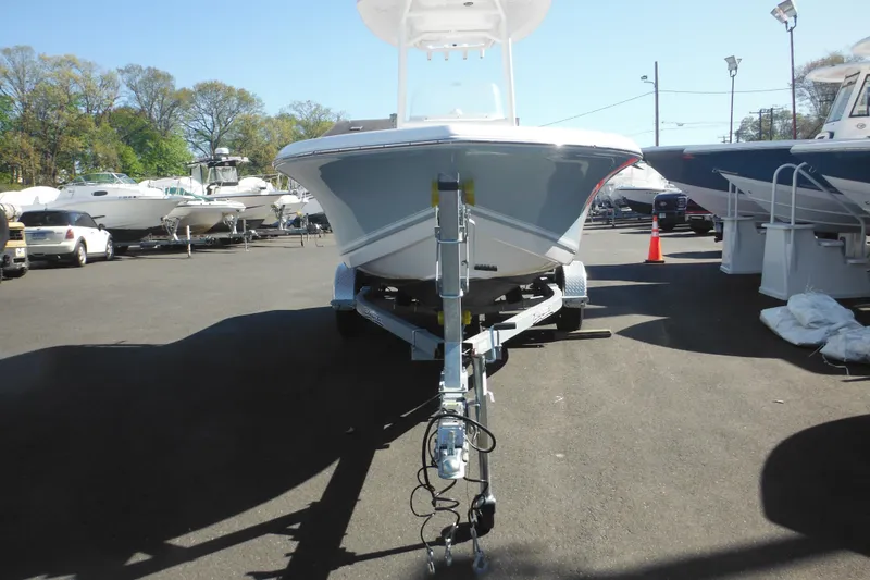 Slide: The Image of 2024 Tidewater 210 LXF boat on trailer in outdoor showroom. - 7