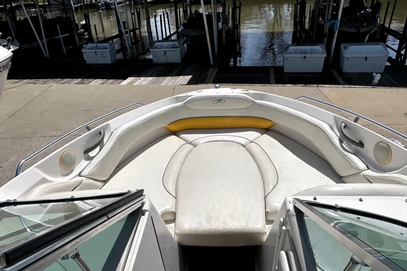 Slide: The Image of 2003 Monterey 218LS Montura Bowrider interior with white seating and waterfront view. - 10