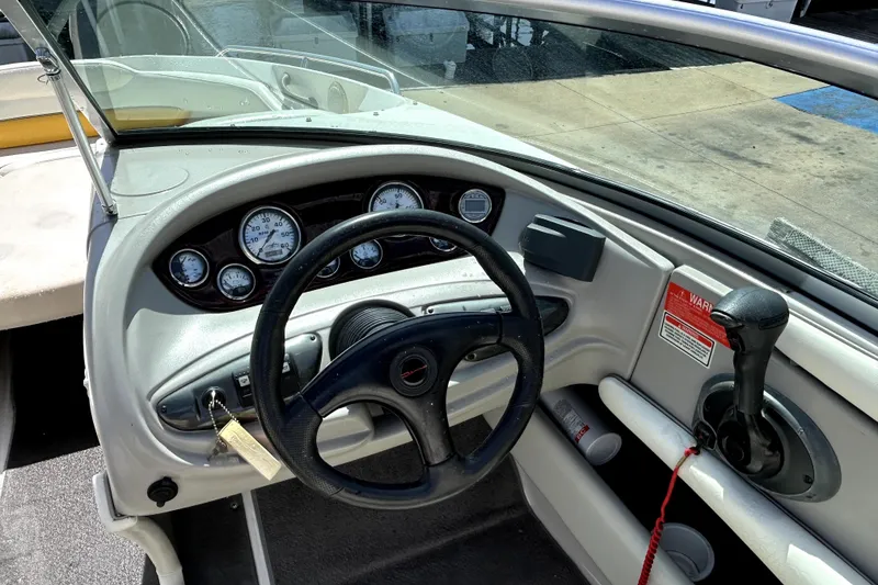 Slide: The Image of 2003 Monterey 218LS Montura Bowrider dashboard with steering wheel and gauges. - 11