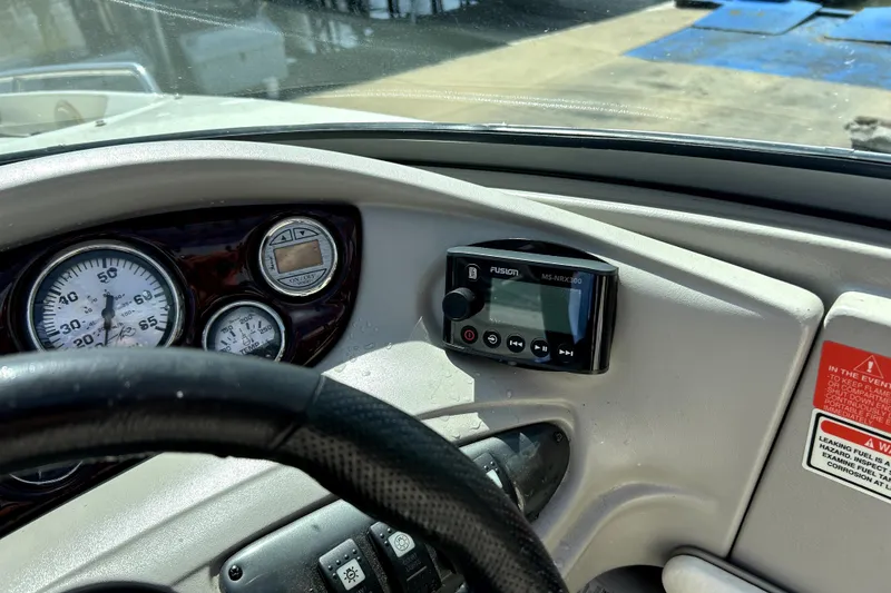 Slide: The Image of Dashboard of a 2003 Monterey 218LS Montura Bowrider with gauges and a Fusion MS-NRX300 unit. - 12