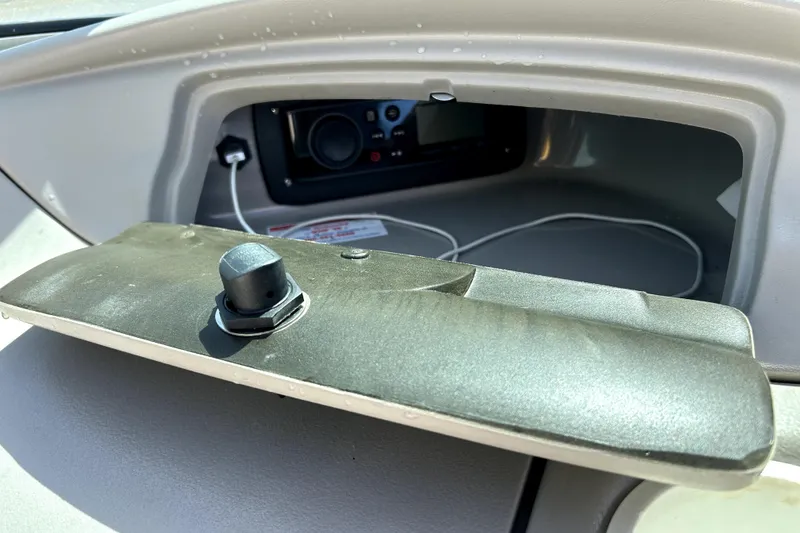 Slide: The Image of Dashboard compartment of 2003 Monterey 218LS Montura Bowrider with audio system and cables. - 13