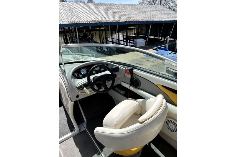 Slide: The Image of 2003 Monterey 218LS Montura Bowrider cockpit with steering wheel and gauges. - 14