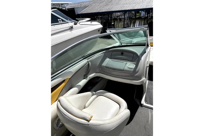 Slide: The Image of 2003 Monterey 218LS Montura Bowrider interior with seating and dashboard view. - 15