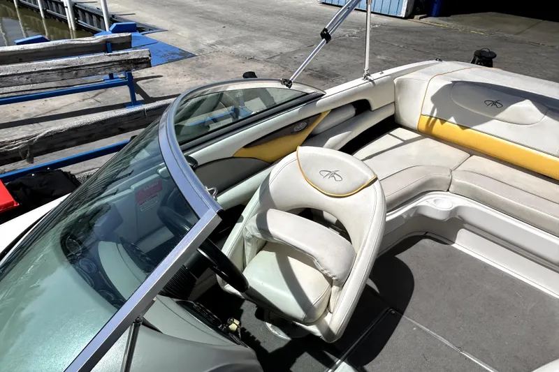 Slide: The Image of 2003 Monterey 218LS Montura Bowrider interior with seating and steering wheel. - 16