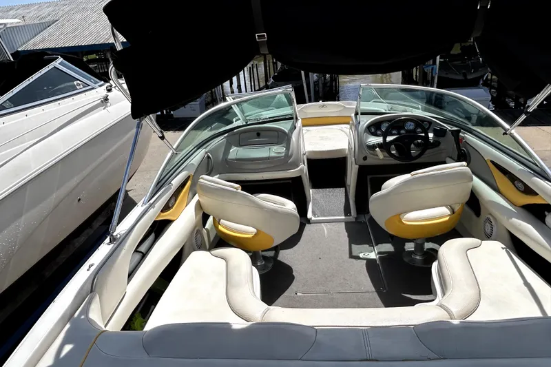 Slide: The Image of 2003 Monterey 218LS Montura Bowrider interior with seating and steering wheel. - 18