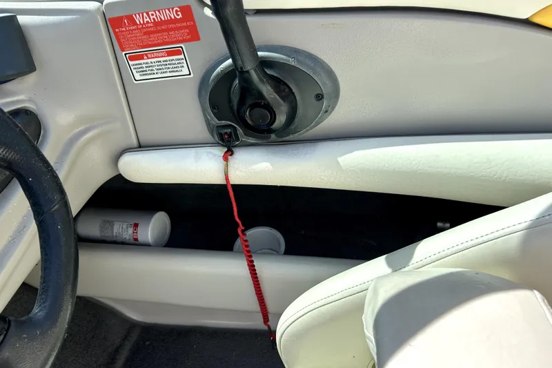 Slide: The Image of Interior of 2003 Monterey 218LS Montura Bowrider showing steering wheel and safety features. - 19
