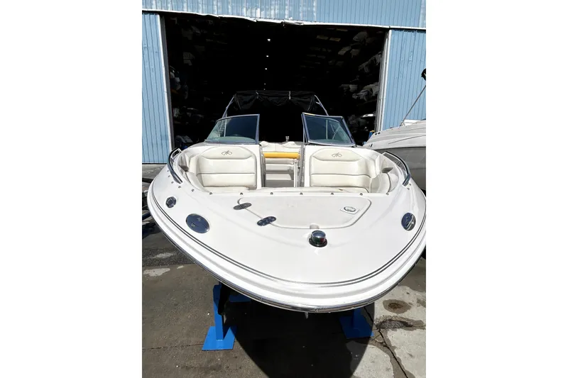 Slide: The Image of 2003 Monterey 218LS Montura Bowrider boat displayed in a storage facility. - 20