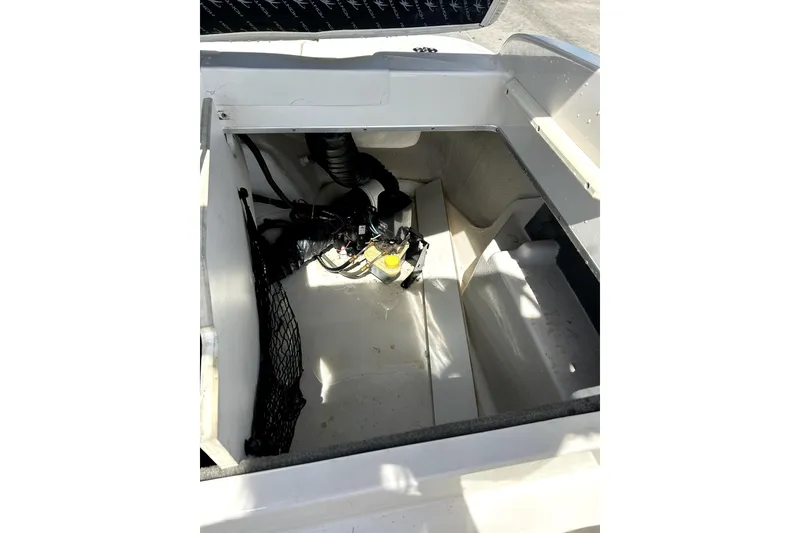 Slide: The Image of Open storage compartment of 2003 Monterey 218LS Montura Bowrider boat. - 23