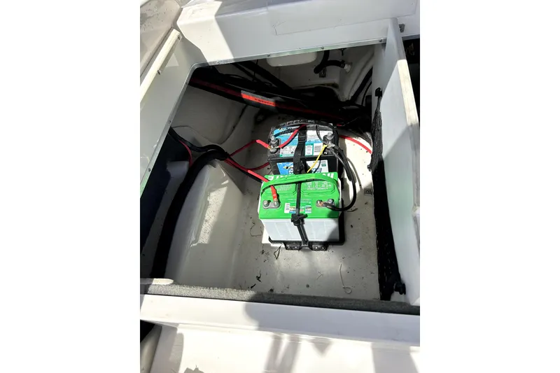 Slide: The Image of Battery compartment of 2003 Monterey 218LS Montura Bowrider with visible wiring. - 24