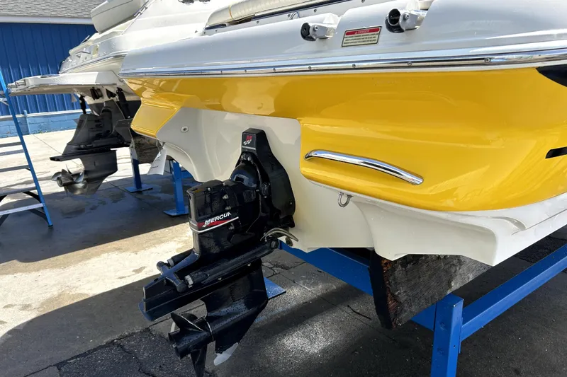 Slide: The Image of 2003 Monterey 218LS Montura Bowrider with yellow hull and Mercury outboard motor. - 4