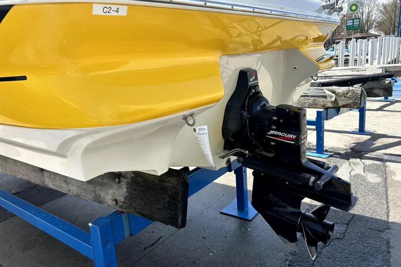 Slide: The Image of 2003 Monterey 218LS Montura Bowrider with Mercury outboard motor, yellow and white hull. - 5