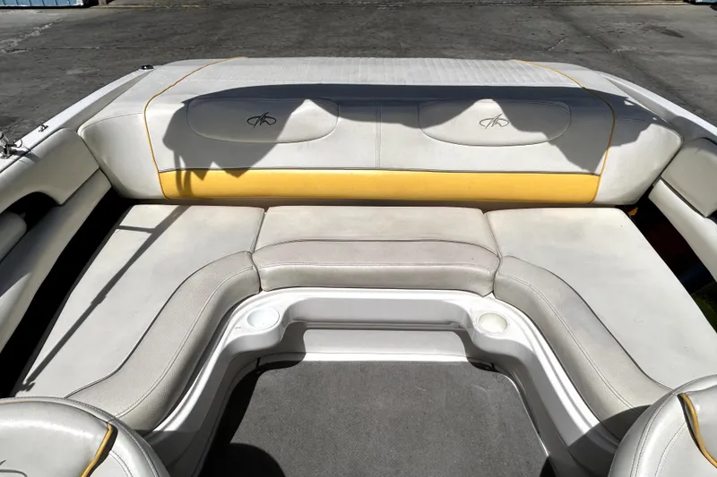 Slide: The Image of 2003 Monterey 218LS Montura Bowrider interior seating with yellow accents. - 6
