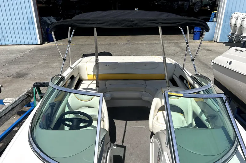 Slide: The Image of 2003 Monterey 218LS Montura Bowrider with black canopy and spacious seating. - 8