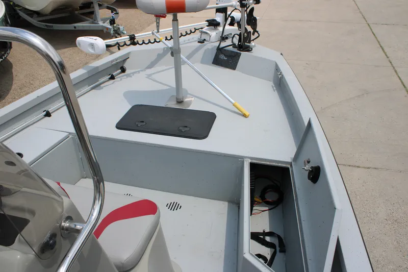 Slide: The Image of 2018 G3 Bay 18 DLX boat interior with seating and storage compartments. - 16
