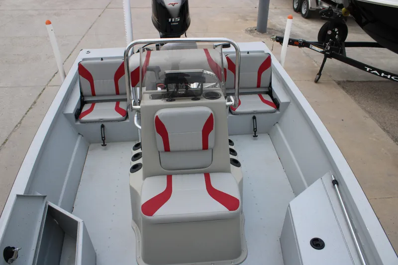 Slide: The Image of 2018 G3 Bay 18 DLX boat interior with red and gray seating, Yamaha 115 engine. - 2