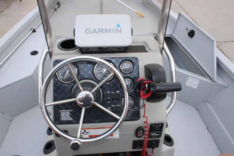 Slide: The Image of 2018 G3 Bay 18 DLX boat dashboard with Garmin GPS and steering wheel. - 20