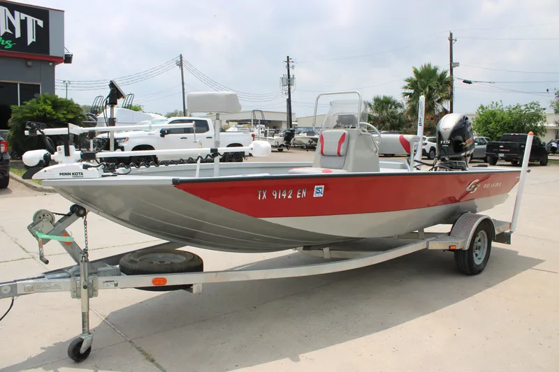 Slide: The Image of 2018 G3 Bay 18 DLX boat on trailer, parked outdoors. - 4