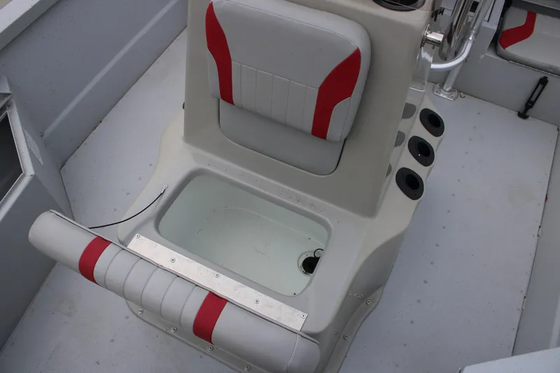 Slide: The Image of 2018 G3 Bay 18 DLX boat interior with seating and storage compartment. - 7