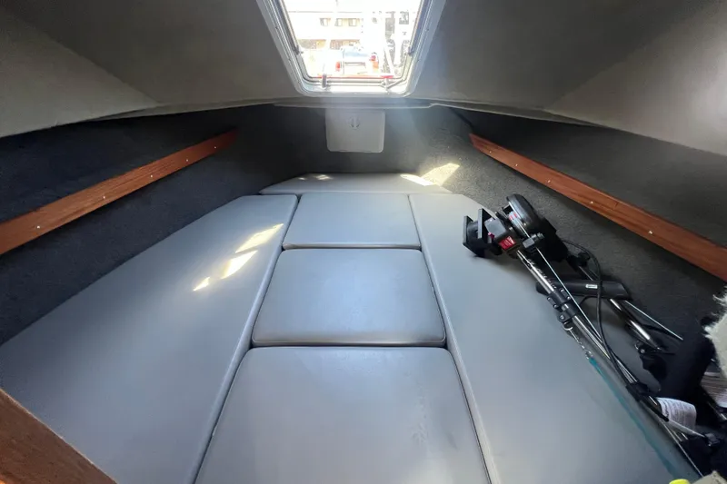 Slide: The Image of 2018 Hewescraft 240 Pacific Cruiser Hardtop cabin interior with fishing gear. - 10