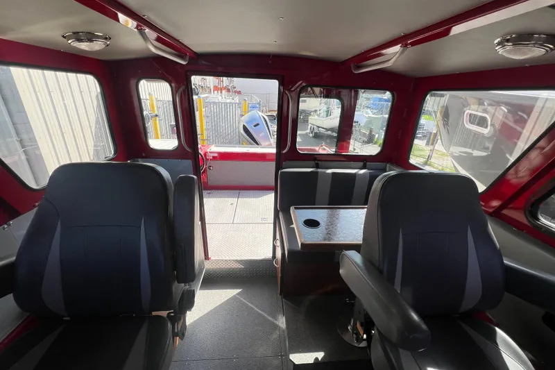 Slide: The Image of Interior of 2018 Hewescraft 240 Pacific Cruiser Hardtop with seating and table. - 11