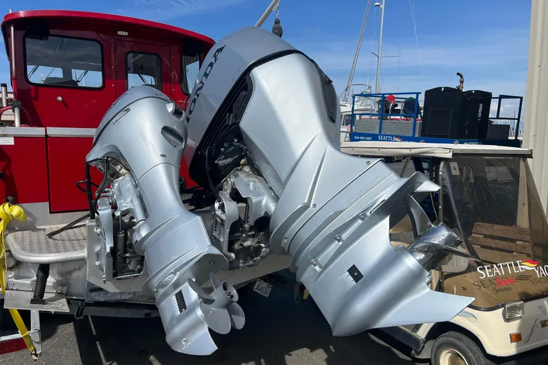 Slide: The Image of 2018 Hewescraft 240 Pacific Cruiser Hardtop with dual Honda outboard motors. - 2