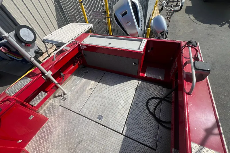 Slide: The Image of 2018 Hewescraft 240 Pacific Cruiser Hardtop, red deck, metal flooring, docked outdoors. - 4