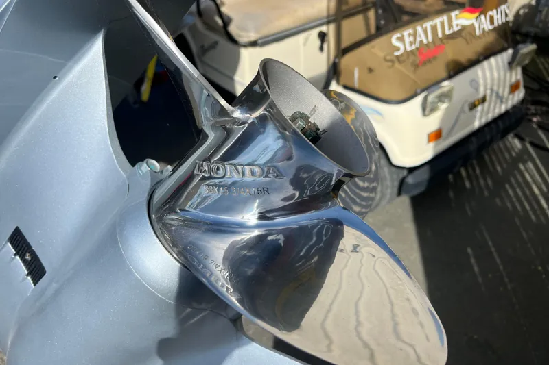 Slide: The Image of Close-up of a Honda boat propeller on a 2018 Hewescraft 240 Pacific Cruiser Hardtop. - 6