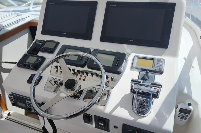 Slide: The Image of Helm of 2009 Cabo 36 Express boat with navigation and control instruments. - 10