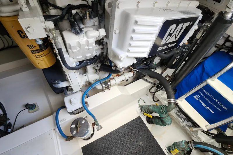 Slide: The Image of Engine compartment of a 2009 Cabo 36 Express boat with CAT Marine Power engine. - 18