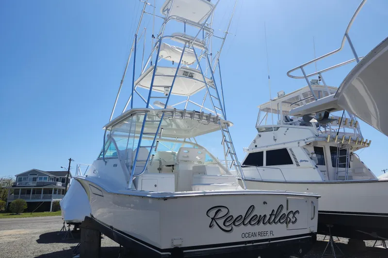 Slide: The Image of 2009 Cabo 36 Express boat named "Reelentless" on display, Ocean Reef, FL. - 4