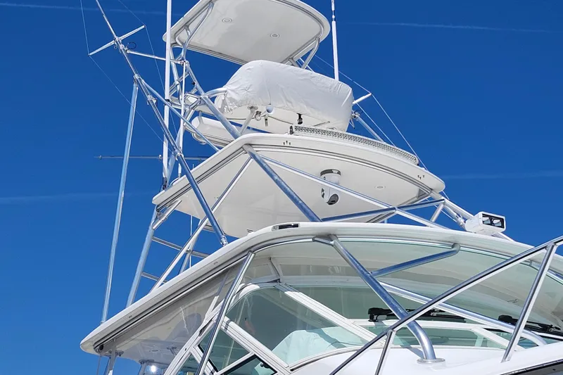 Slide: The Image of 2009 Cabo 36 Express yacht tower against clear blue sky. - 6
