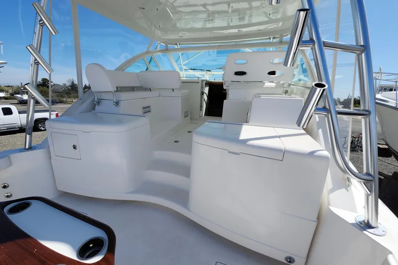 Slide: The Image of 2009 Cabo 36 Express boat interior with seating and stainless steel fixtures. - 8