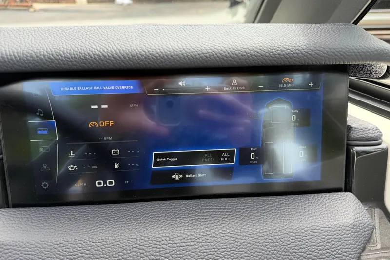 Slide: The Image of 2026 Nautique Super Air Nautique GS24 touchscreen display showing ballast and speed controls. - 17