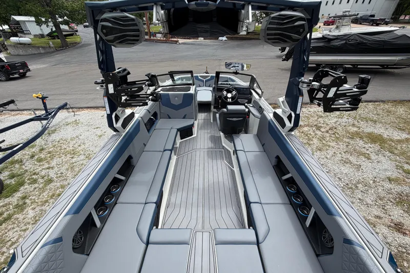 Slide: The Image of 2026 Nautique Super Air Nautique GS24 interior with sleek seating and advanced controls. - 7