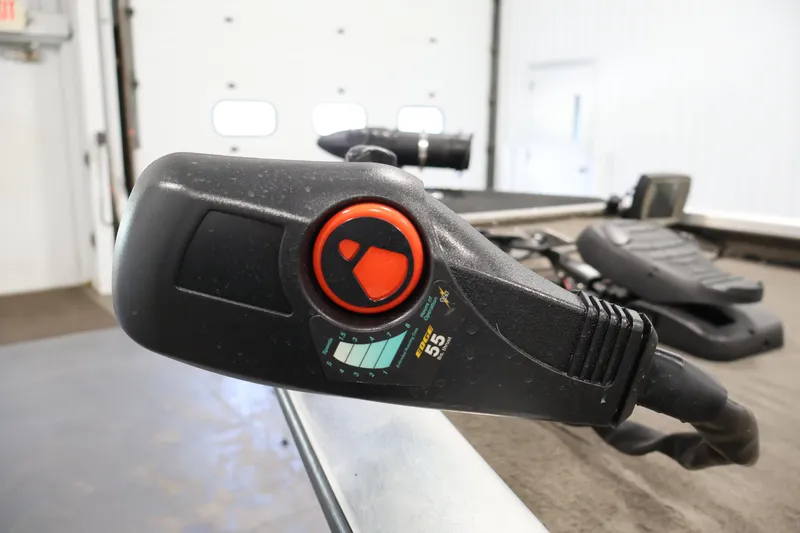 Slide: The Image of Close-up of a 2003 Tracker Pro Team 175 boat control panel indoors. - 12