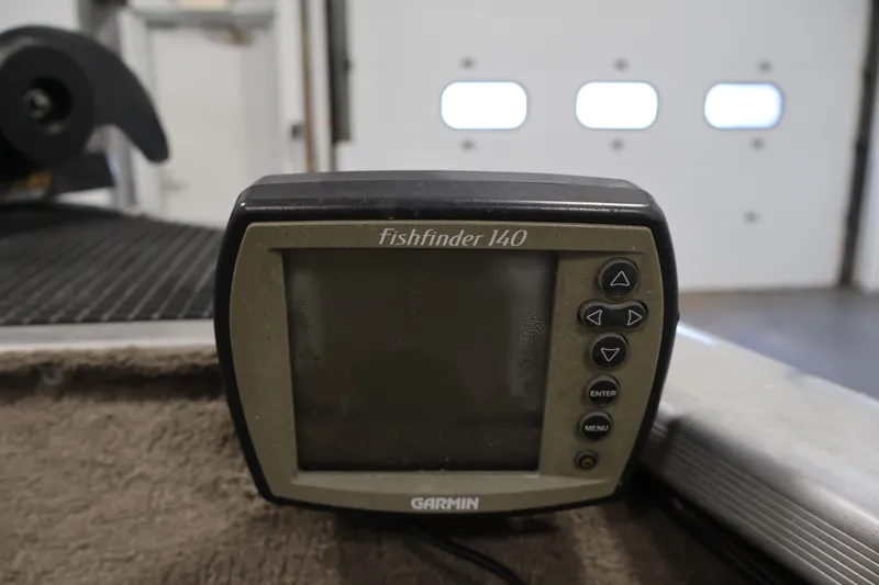 Slide: The Image of Garmin Fishfinder 140 on 2003 Tracker Pro Team 175 boat, indoor setting. - 15
