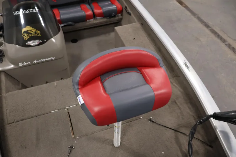 Slide: The Image of 2003 Tracker Pro Team 175 boat interior with red and gray seating. - 16