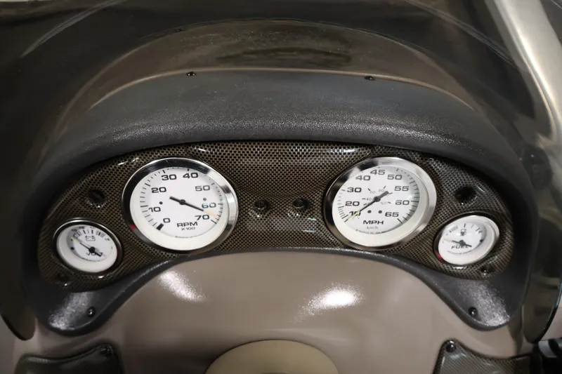 Slide: The Image of Dashboard of a 2003 Tracker Pro Team 175 boat with speedometer and gauges. - 24