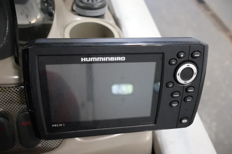 Slide: The Image of Humminbird Helix 5 fish finder on 2003 Tracker Pro Team 175 boat dashboard. - 25
