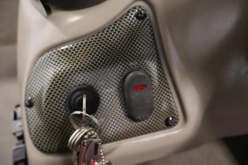 Slide: The Image of Close-up of ignition switch with keys in a 2003 Tracker Pro Team 175 boat. - 26