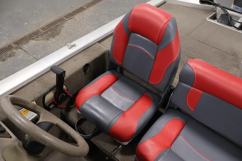 Slide: The Image of 2003 Tracker Pro Team 175 boat interior with red and gray seats. - 29