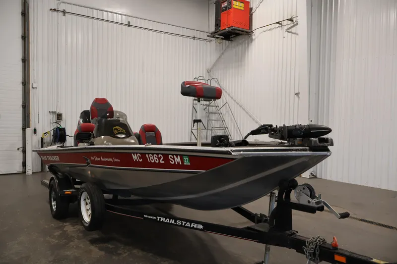 Slide: The Image of 2003 Tracker Pro Team 175 boat on trailer in indoor storage facility. - 3