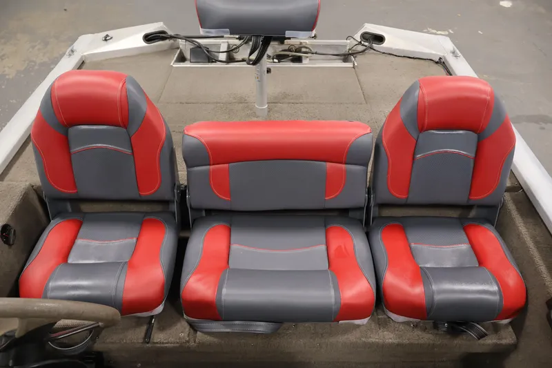 Slide: The Image of 2003 Tracker Pro Team 175 boat seats, red and gray upholstery, interior view. - 30