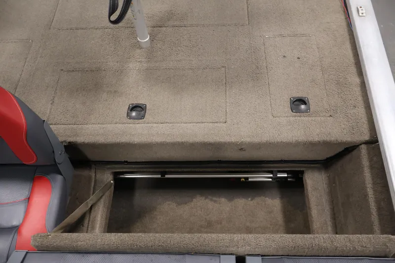 Slide: The Image of 2003 Tracker Pro Team 175 boat interior with storage compartment open. - 31