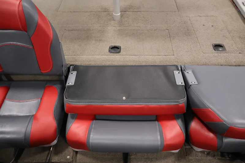 Slide: The Image of 2003 Tracker Pro Team 175 boat seats with red and gray upholstery. - 32